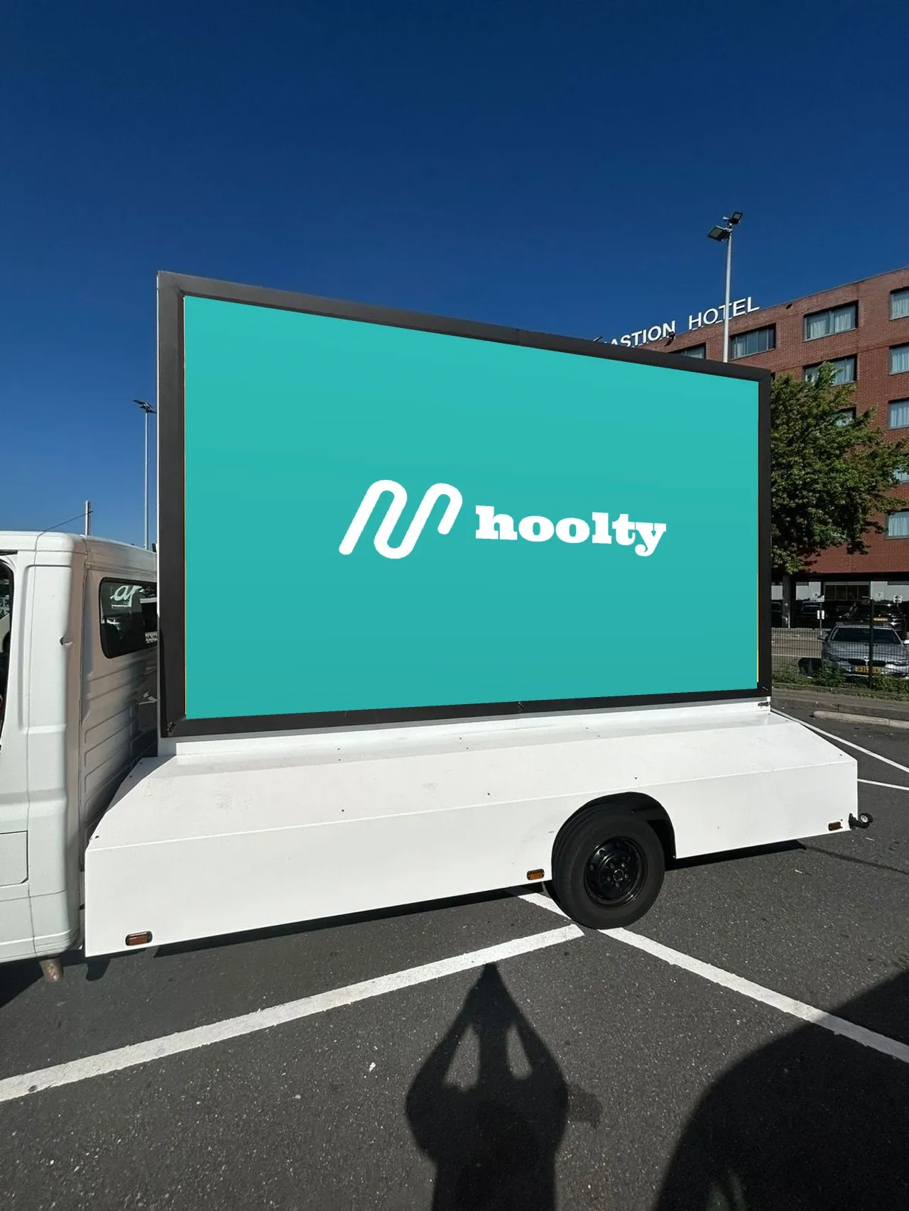Hoolty billboard truck in a business district
