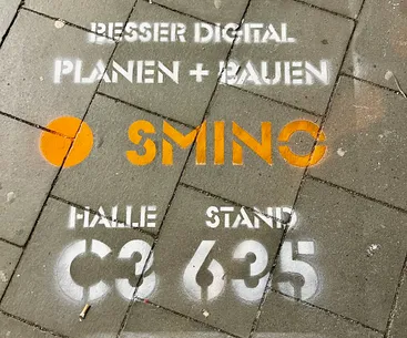 smino chalk stencil on the walking path to BAU 2025