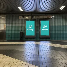 Hoolty screens in a metro station on the way to the venue